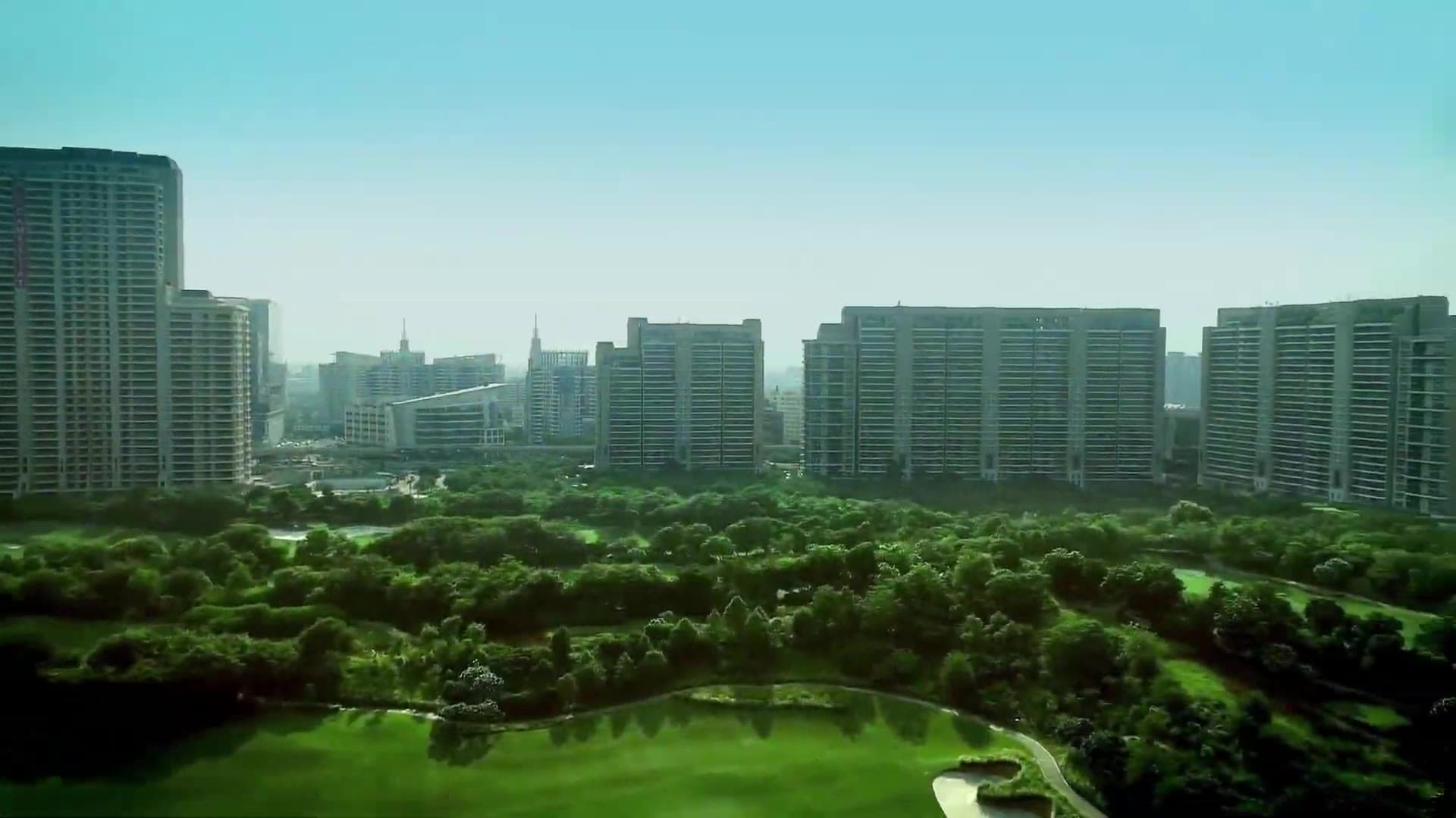 Aerial view over the DLF golf course towards The Magnolias and The Aralias, Golf Course Road, Gurugram