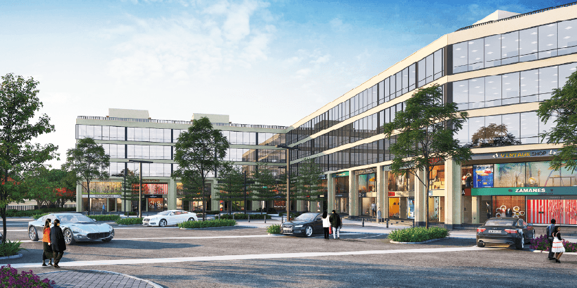 DLF Garden City Central — glass-fronted shop-cum-office buildings along the street