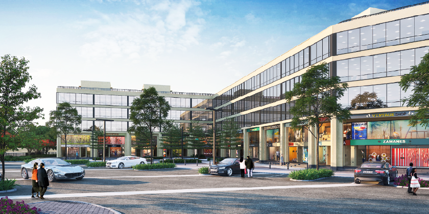 DLF Garden City Central — glass-fronted shop-cum-office buildings along the street